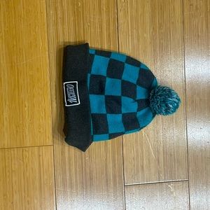 Official beanie. Blue and black with Pom Pom at top.